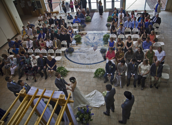 Overhead view of an atrium wedding ceremony at FACC.
