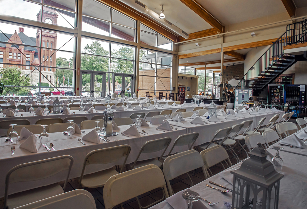 Banquet-style wedding reception setup in the Atrium with a full view of the courthouse at the Fairfield Arts & Convention Center in Fairfield, Iowa.