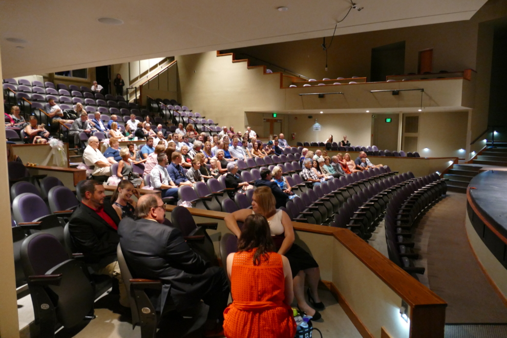 Wedding guests seated in the Theater at the Fairfield Arts & Convention Center in Fairfield, Iowa, waiting for the ceremony to begin.