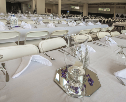 Banquet-style wedding reception setup in the combined Cambridge and Smith rooms at the Fairfield Arts & Convention Center in Fairfield, Iowa.