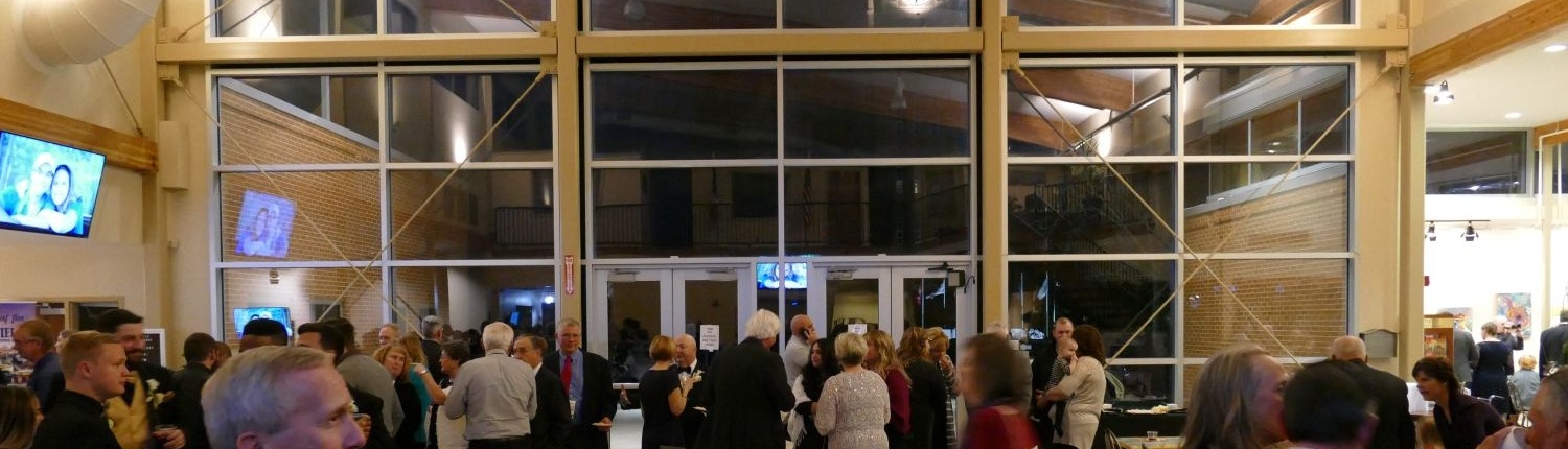 Cocktail hour setup in the Atrium at the Fairfield Arts & Convention Center for an indoor wedding in Fairfield, Iowa.